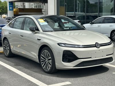 Electric sedan with LED light bar and aerodynamic design