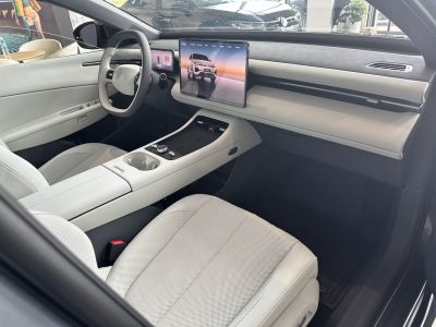 Futuristic interior with digital dashboard and large touchscreen display