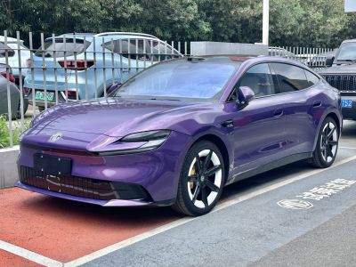 Purple sleek aerodynamic electric sedan with modern wheel design