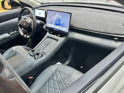Dual digital displays and quilted leather seats in a modern car interior