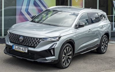 Front and side view showing sleek headlight and grille design