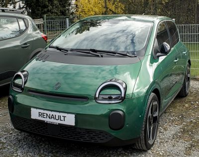 Compact car with unique rounded headlights and sleek front design