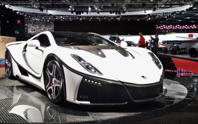 White supercar with carbon fiber elements and aerodynamic shape