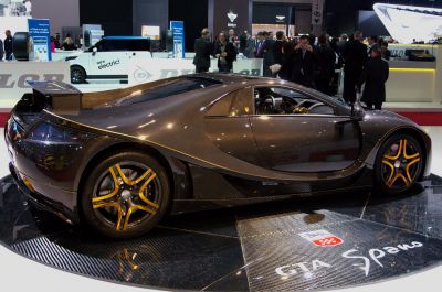 Carbon fiber body with yellow-accented rims in side view
