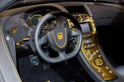 Carbon fiber steering wheel with gold-accented center console