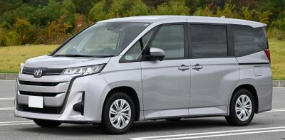 Modern minivan front grille and side profile with large windows