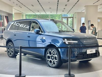 Sleek SUV front-side with modern LED headlights and distinctive wheels