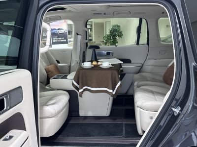 Luxurious leather seats with central table setup inside vehicle cabin