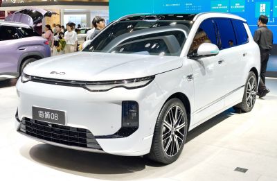 Front and side view with sleek headlights and alloy wheels
