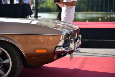 Close-up of classic car front with chrome bumper and amber side marker