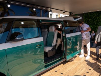Electric van interior with sliding door and passenger seating