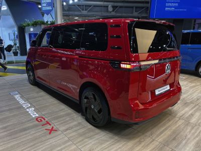 Electric van rear and side view with black alloy wheels and red body