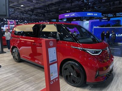 Red modern electric van with sleek headlights and aerodynamic design