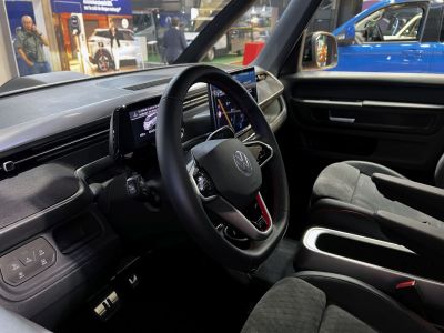 Interior featuring digital displays, touchscreen, and modern steering wheel