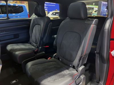 Spacious second-row seats with premium upholstery and red stitching