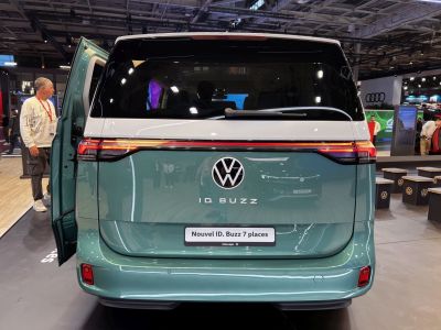 Rear view of an EV van with continuous LED taillights and two-tone paint