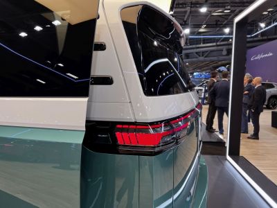 Rear quarter view with modern segmented taillight and large window