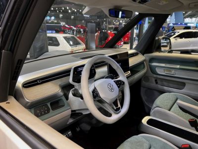 Modern digital display and touchscreen dashboard with white steering wheel