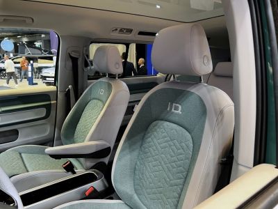 Front seats with green fabric and leather upholstery