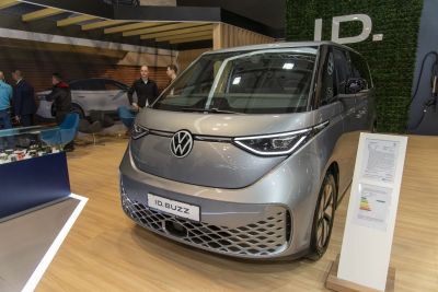 Front view of a modern electric MPV with distinctive LED headlights
