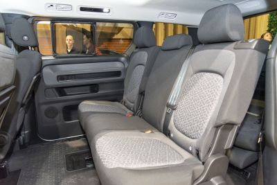 Spacious rear seating with patterned upholstery and large window