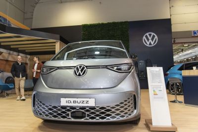 Front view with narrow modern headlights and large logo emblem