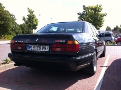 Rear view of classic sedan with taillights and badging