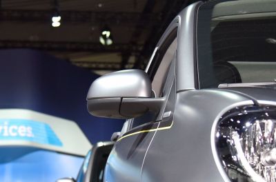 Close-up of side mirror and front headlight