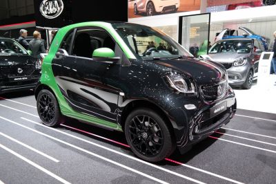 Compact electric vehicle with two-tone paint and black alloy wheels