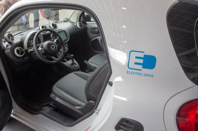 Electric drive badge and interior cabin with steering wheel and dashboard