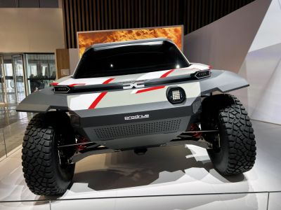 Futuristic off-road vehicle with aggressive tires and angular body design