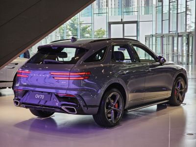 Rear view featuring horizontal LED tail lights and dual exhaust pipes.