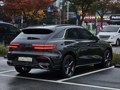Rear view of a sleek SUV with LED tail lights and dual exhausts
