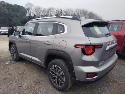 Rear side profile showing rugged SUV design, taillights, and alloy wheels