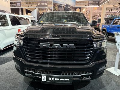 Front grille and headlights of a black pickup truck