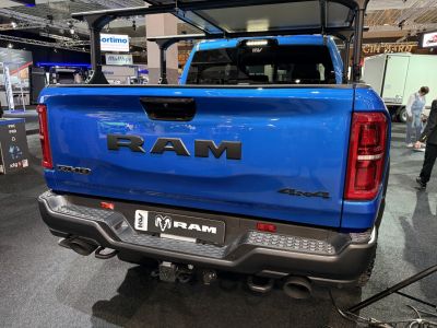 Pickup truck rear tailgate, dual exhaust pipes, rear bumper step