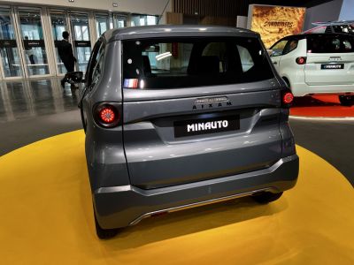 Compact vehicle rear with round tail lights and minimalistic styling