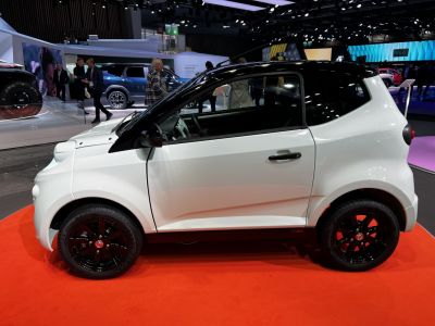 Compact mini urban vehicle with black roof and black alloy wheels