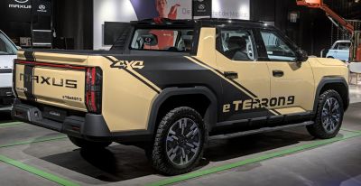 Pickup truck rear side with 4x4 badge and rugged tires