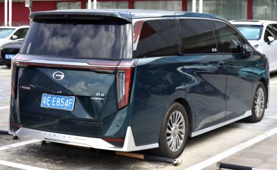 Rear view of hybrid minivan with vertical taillights and alloy wheels