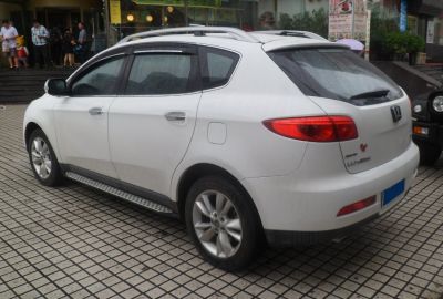 Side and rear view of a white SUV with distinctive tail lights and roof rails