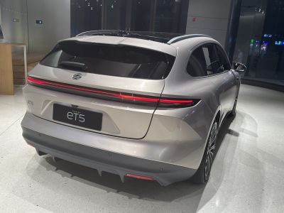 Rear view with continuous LED tail light and smooth hatchback design