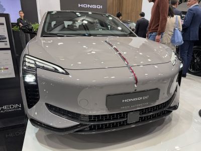Front view with distinctive LED headlights and sleek grille design.