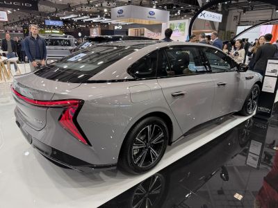Rear side profile with angular LED tail lights on electric sedan
