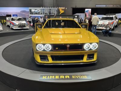 Front view of yellow Kimera EVO38 with LED ring headlights and aggressive sport vents