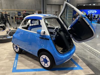 Compact microcar with distinctive front-opening door and retro styling
