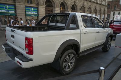 Pickup truck rear side with cargo bed and alloy wheels