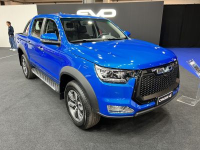 Blue pickup with bold grille and LED headlights