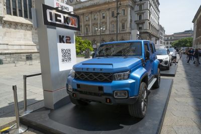 Rugged SUV front with bold grille and urban display