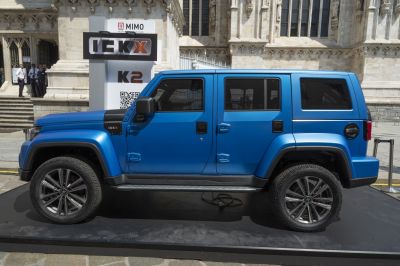 Side view of rugged electric SUV with large wheels and boxy design